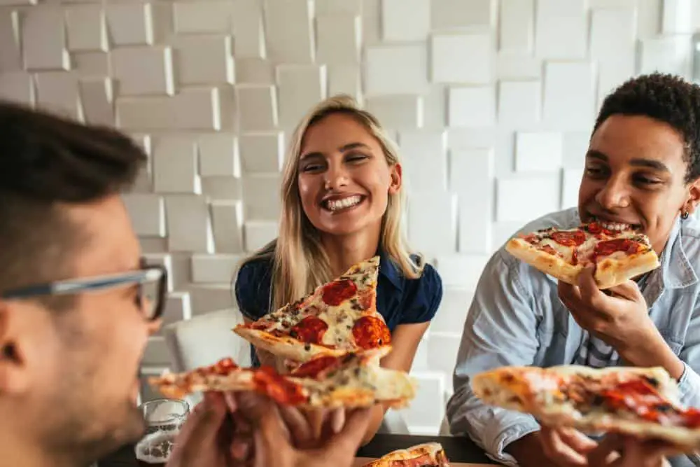 friends and family celebrating National Pizza Day